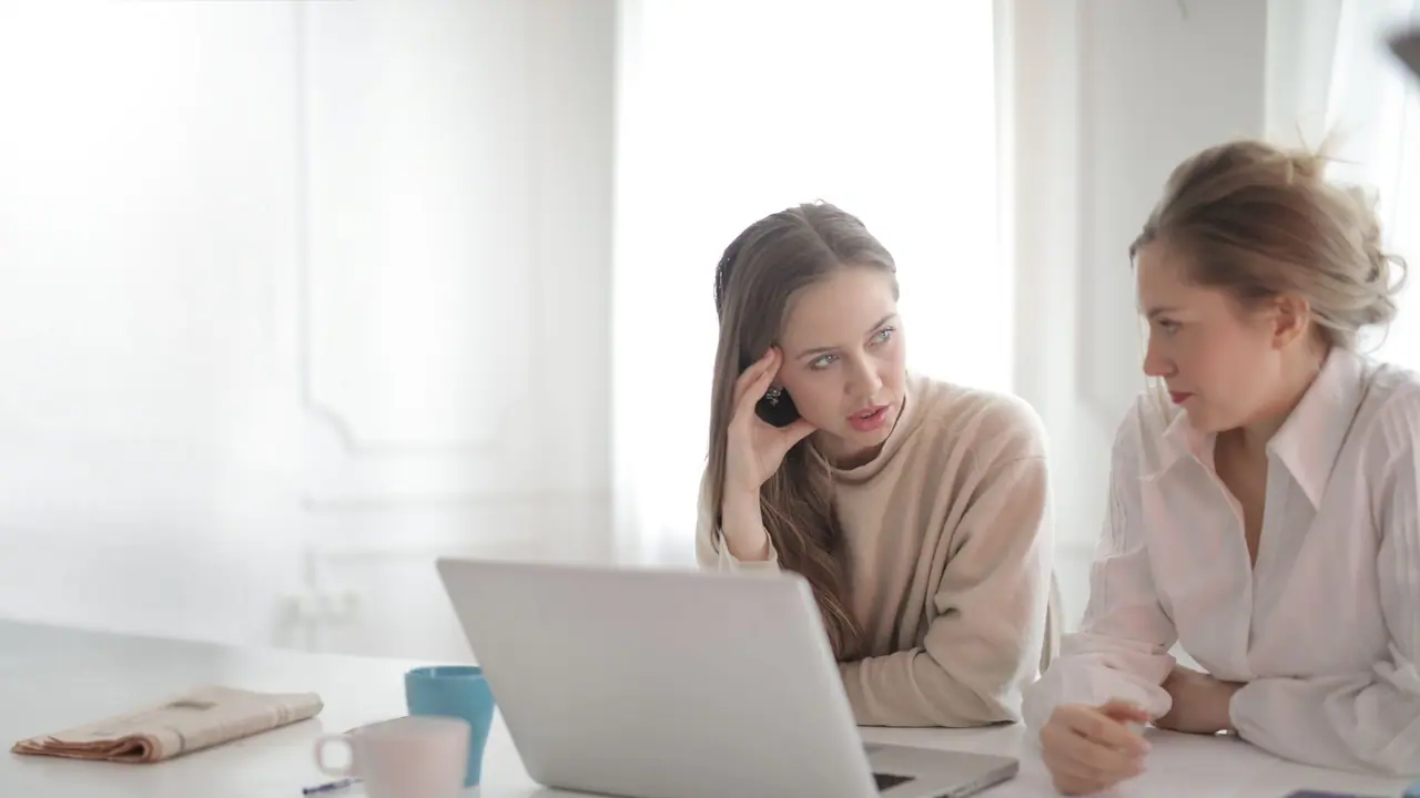 Person reviewing streaming provider options on a laptop for qwevo tv buying guide