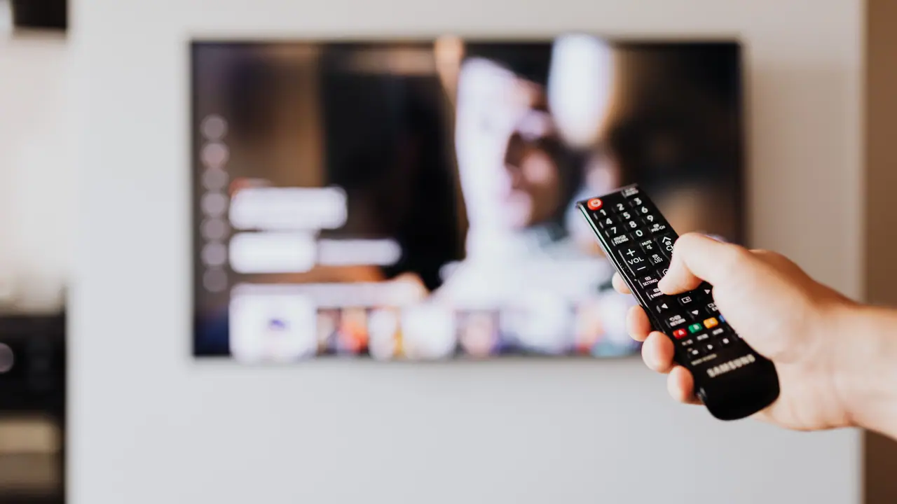 Modern Smart TV streaming interface in a living room for qwevo tv setup